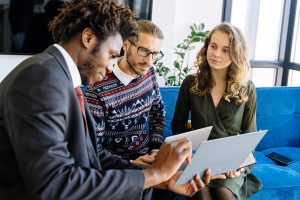 insurance agent discussing an insurance policy with clients