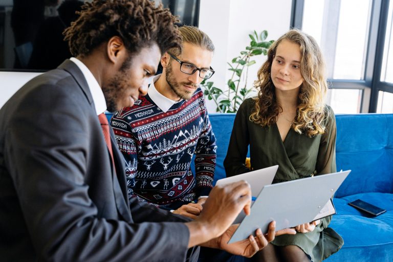 insurance agent discussing an insurance policy with clients